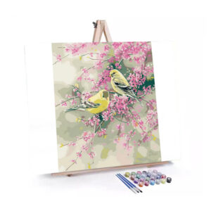 American Goldfinch in Pink Blossom paint by numbers displayed on a easel