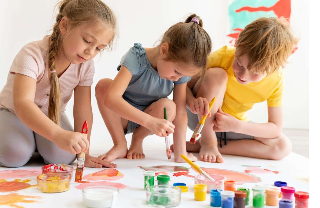 Happy Kids Creating Art: Children painting, showcasing their creativity and joy with bright colors and playful strokes.